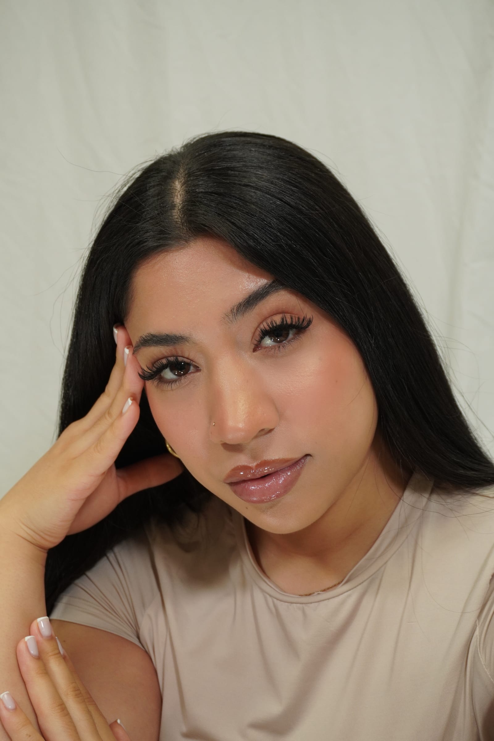 Studio portrait showing a balanced Hybrid lash set.