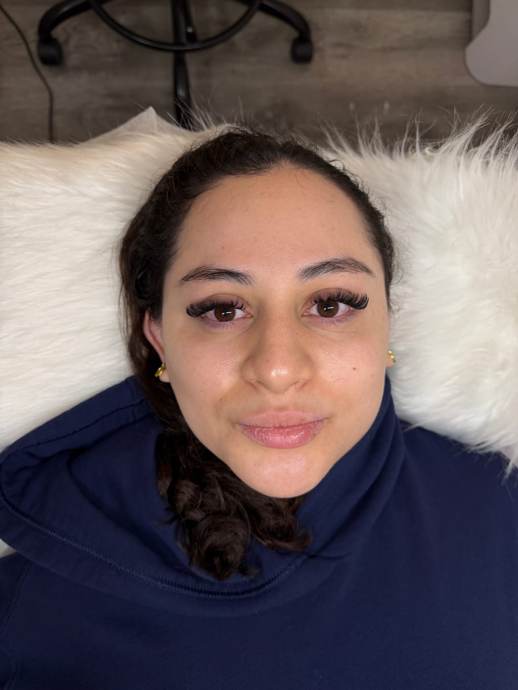 Client showing a customized lash extension result created by Jewels at Silk Lash Empire.